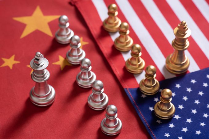 Chess game. Two team stand confront each other on China and USA national flags. Trade war concept.