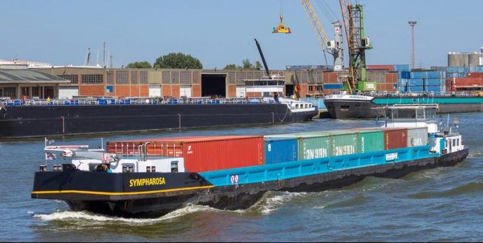 Barge ship transporting containers in the Port of Antwerp