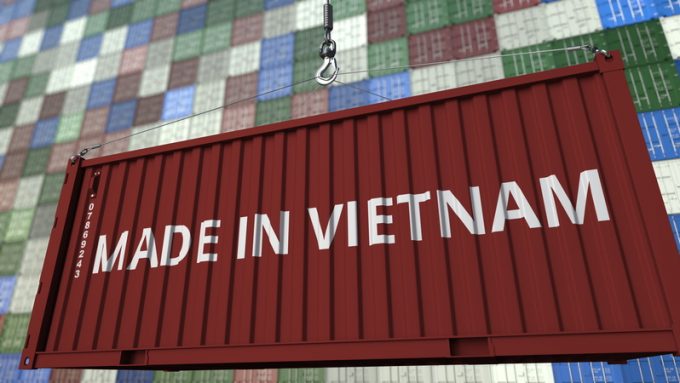 Loading container with MADE IN VIETNAM caption. Vietnamese import or export related 3D rendering