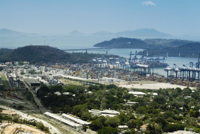 Aerial View Of Panama Industrial Port On The Atlantic Side. Large Harbor Cranes At The Commercial Dock In Panama City