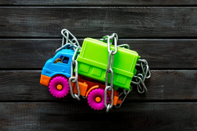 Chain around the truck for car protection concept on wooden background top view