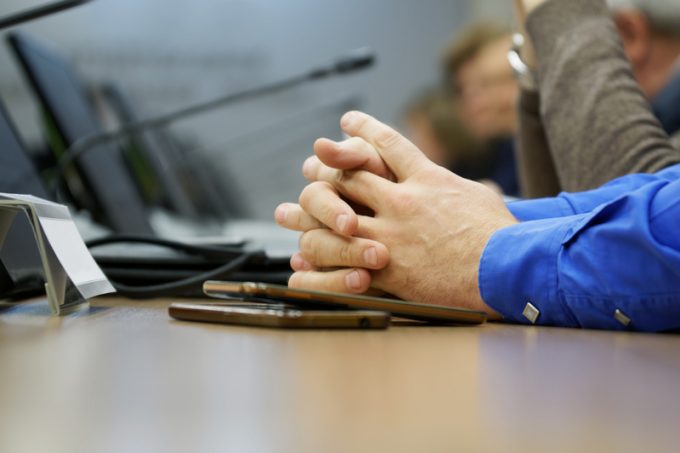Hands of a businessman - participant in a meeting or negotiation