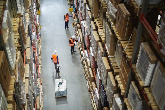 Movers and Loaders Working in Warehouse