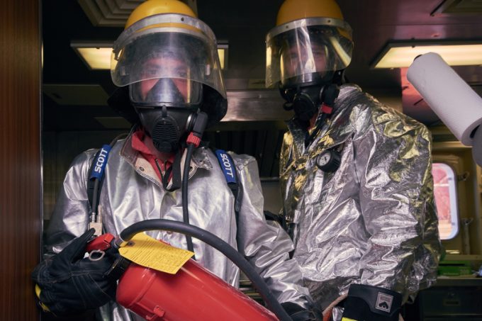 At sea - September 2018: International ship's crew performing monthly fire drill exercise.