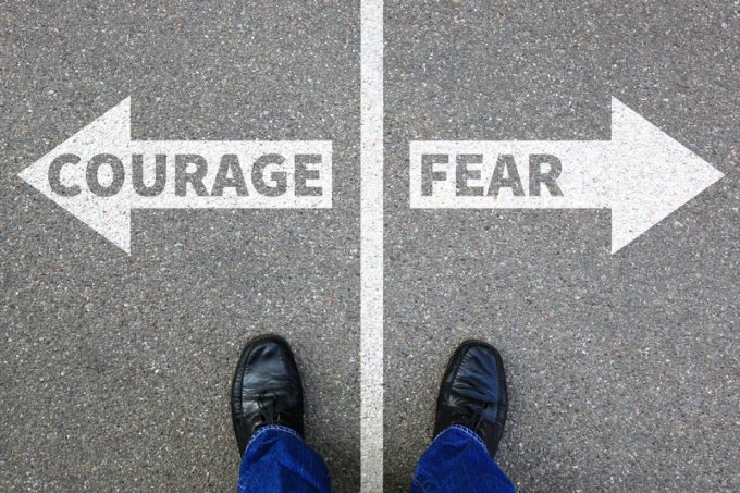 Courage and fear risk safety future strength strong business concept danger