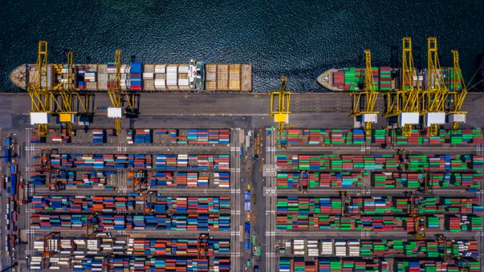 Aerial top view container cargo ship unloading in import export