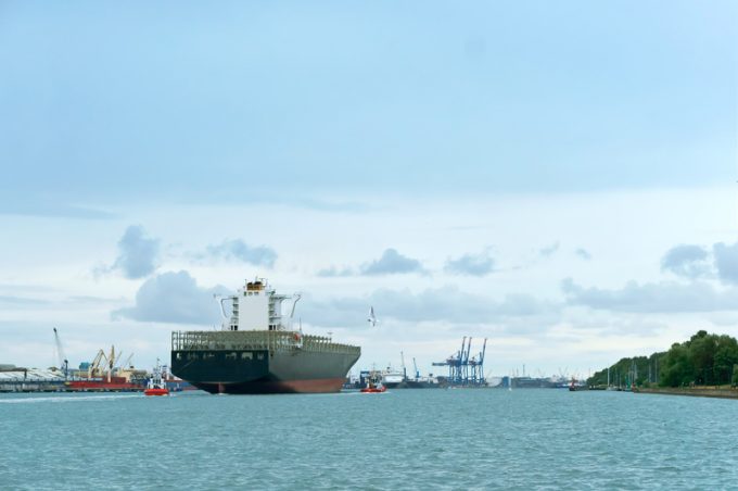 blue cargo ship on water, huge empty container ship