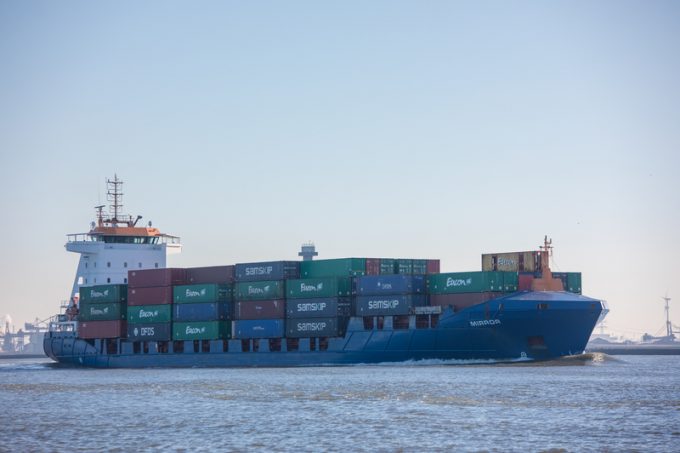 cargo shipping container vessel near port Rotterdam