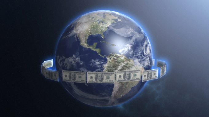 Dollar bills around Earth planet, money ruling world, cash flow, global trade