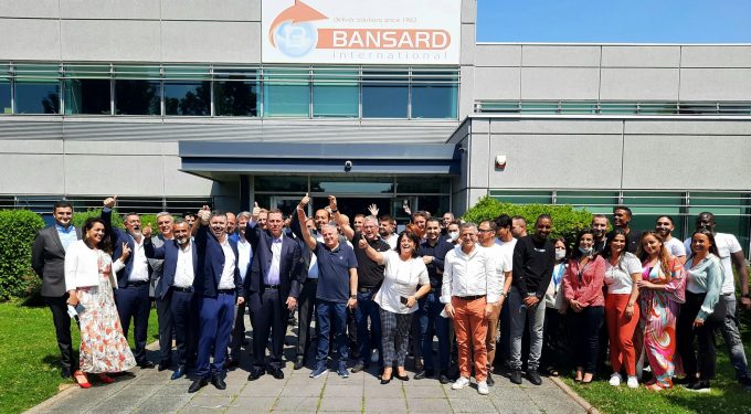 Simon Pinto and James Gagne with members of the Bansard International team at the companys headquarters in Paris (1)